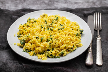 Sticker - rice with egg and spinach on plate