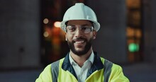 Face, architecture or happy man in city with confidence or smile for engineering labor or building. Construction site, safety and portrait of a proud builder, worker and contractor in night project