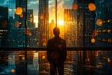 Fototapeta  - A contemplative silhouette of a man stands against an office window looking out at a city sunrise