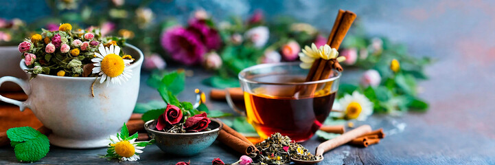 Wall Mural - cup of tea with herbs. Selective focus.