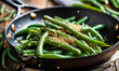 green beans with sesame seeds in a frying pan. Selective focus.