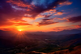 Fototapeta Góry - Epic Sunrise/Sunset Scene Displaying Radiant Sky Colors Over Low-Lying Hills.