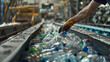  Worker sorting plastic bottles at a recycling facility.