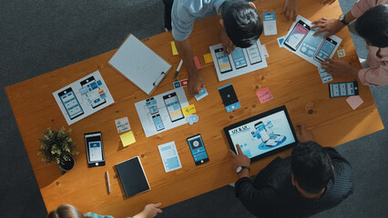 Top view of smart software developer planning software development. Skilled programmer team brainstorming and designing Ux UI design for mobile phone interface or digital creative design. Convocation.