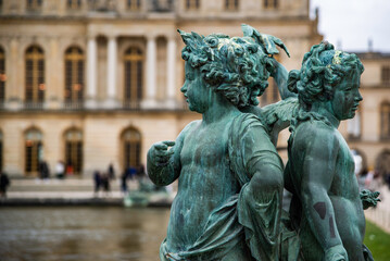 Wall Mural - Versailles, France - Dec. 28 2022: The bronze statue in the garden of Versailles Palace in France