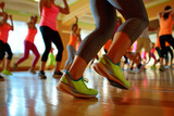 A group of people are dancing in a gym, wearing neon green shoes
