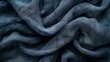 Moody image of dark fabric draped, emphasizing its luxurious texture