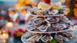 As midnight approaches a tower of oysters on the half shell accompanied by a variety of y sauces and lemon wedges is brought out as a festive and indulgent treat.