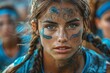 © svastix - Young athletic woman with tribal face paint looks intently, suggesting a competitive spirit