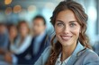 © svastix - Vibrant headshot of a cheerful businesswoman with blue eyes and a beaming smile in an office