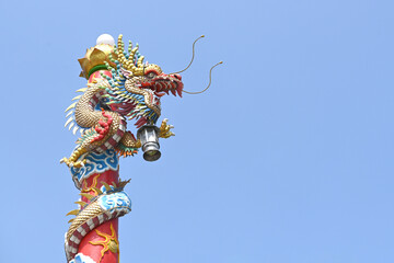 Wall Mural - Colorful dragon statue at a Chinese temple in Thailand