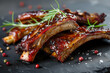 Barbecue pork ribs slathered in sweet savory and sticky barbecue sauce 