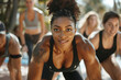 © Centric  - Energetic woman leading a group workout session outdoors, focus on health and community
