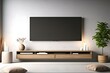 A modern TV lounge room with a white empty canvas frame for a mockup mounted above an entertainment console, harmonizing art and technology.
