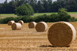 stubble field with haybales in rural Switzerland
