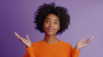 Canvas Print - A woman in an orange sweater is showing a highly animated expression of surprise with wide eyes and mouth open, hands raised in an expressive gesture.