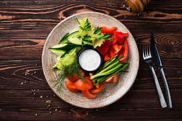 Sticker - Vegetarian salad with cucumbers, lettuce, tomatoes, sweet pepper, green onion, parsley, dill and sauce.