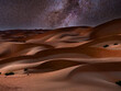 Winter side of the Milky Way over desert sand dunes