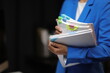 © Kainnika - Businesswoman hands working in Stacks of paper files for searching and checking unfinished document achieves on folders papers at busy work desk office.
