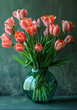 Tulips in green glass vase on green Background Spring tulip bouquet

