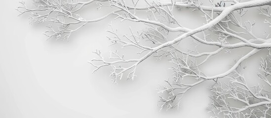 Sticker - A tree covered in snow stands prominently in the stark black and white landscape. The branches are weighed down by the snow, creating a dramatic contrast against the blanketed ground.