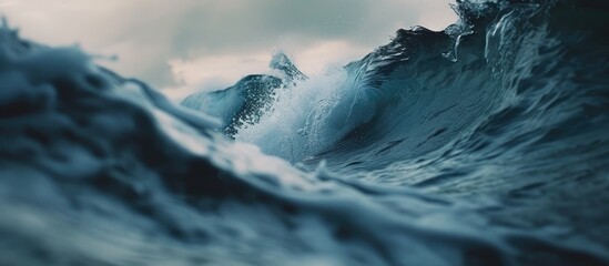 Poster - A large, powerful wave rises in the middle of the ocean, showcasing the raw force of nature. The wave is towering and crashing, creating a dynamic and intense scene in the vast expanse of the sea.