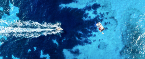 Wall Mural - vacation and leisure. aerial view on fast boat and yacht on azure sea at sunny day. drone view of a 