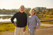 © Studio Romantic - Portrait of active senior happy smiling couple family standing in city park after doing workout in nature or jogging exercises. Sport, fitness training in retirement and healthy lifestyle concept.