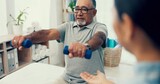 Fototapeta  - Senior care, exercise and physiotherapist with old man, dumbbell and healthcare at nursing home. Physio, rehabilitation and retirement, fitness coach caregiver and elderly patient mobility training
