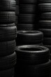 Close-up of rubber tires for the summer or winter season of different thicknesses and diameters on racks in a warehouse of a shop, the store or in the workshop
