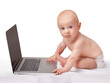 © T. Rose/peopleimages.com - Baby, laptop and studio for portrait, fun and games in child development and curious technology. Infant, happy and newborn for home, diaper and white background for playful and sitting by tech