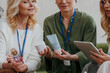 © gstockstudio - Group of mature women examining beauty products during specialized conference