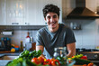 smiling young man on kitchen counter with vegetables preparing delicious food