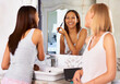 Bathroom, mirror and friends with makeup or cosmetics in morning, routine and getting ready together. Women, beauty and happy reflection of girl with brush on face to apply powder or eyeshadow