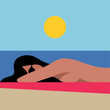 Woman is sunbathing on the beach