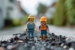 A male and female engineer lego figures standing on a pile of coal