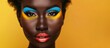 © FryArt - A bold African woman showcases bright blue and yellow makeup in a captivating portrait.