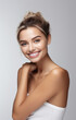 © tinyt.studio - Beautiful model woman with clear facial tan healthy skin and a big pretty smile on her face light white gray background