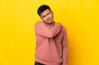 © luismolinero - Young Ecuadorian man isolated on yellow background suffering from pain in shoulder for having made an effort