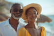 © sofiko14 - African American senior couple in love walking on sandy beach on seashore