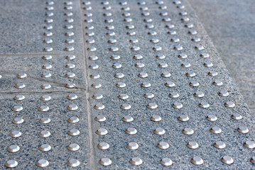 stair step with anti-slip tactile stud system for visually impaired individuals against potential ha
