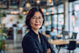 Fototapeta Boho - middle aged asian american woman in office