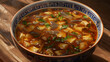 Traditional asian hot and sour soup in decorative bowl