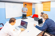 © unai - People with special needs attending a IT class using laptop