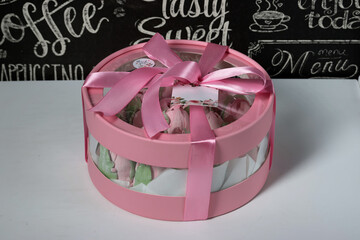 Wall Mural - Zephyr in a box. Marshmallow tulips. The box is pink, tied with a ribbon.