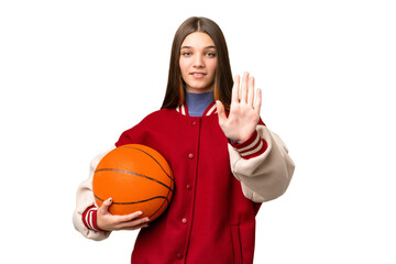 Sticker - Teenager girl playing basketball over isolated chroma key background making stop gesture