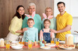 © Pixel-Shot - Big family at Easter dinner in kitchen