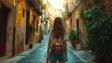 Fototapeta Fototapeta uliczki - Traveler Exploring Old Town Streets, young woman, viewed from behind, wanders through the narrow, sunlit streets of an old town, exuding a sense of adventure and curiosity