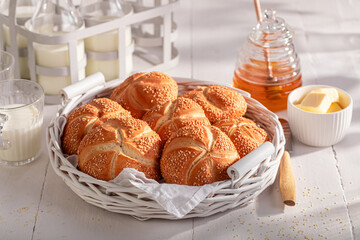 Wall Mural - Homemade Kaiser rolls with sesame seeds baked for golden brown.