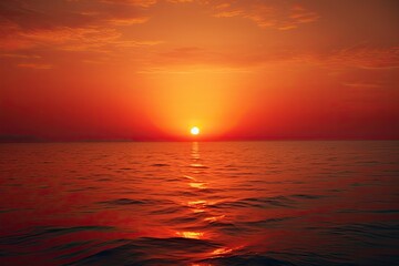 Wall Mural - Big Red Sunset over the Orange Ocean. Stunning Nature Shot of Sun Setting over the Surging Sea. 